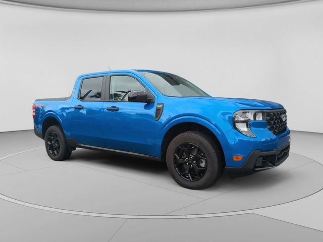 2025 Ford Maverick XLT in Velocity Blue — front three-quarter view