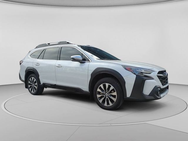 2023 Subaru Outback Touring in Crystal White Pearl — front three-quarter view